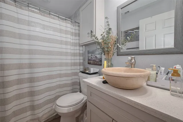 a bathroom with a toilet and a sink