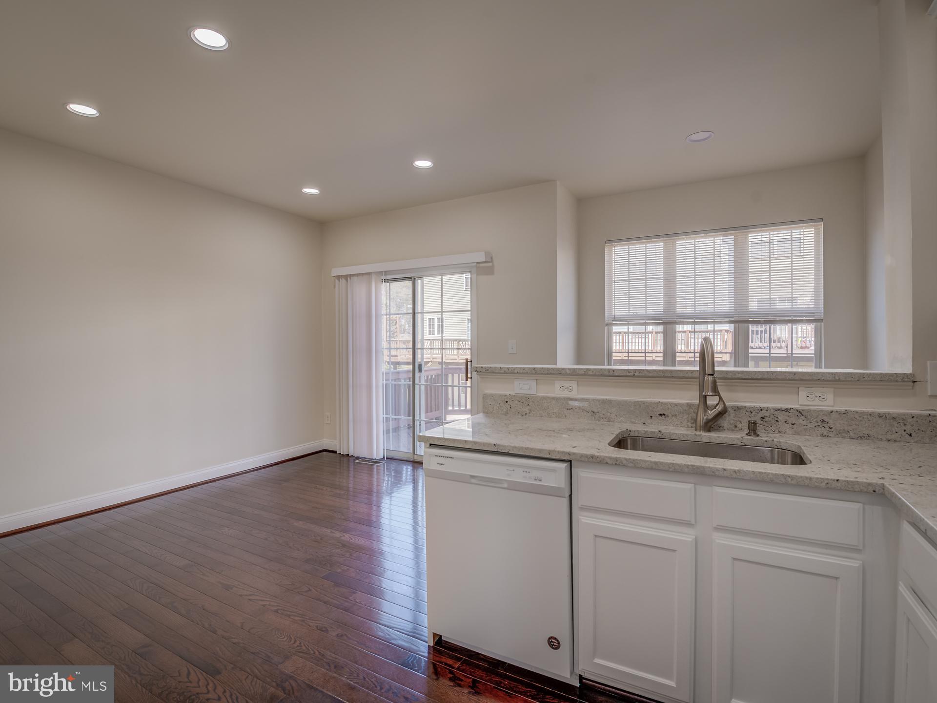 13510 Turquoise Lane Herndon, VA 20170 - Photo 22 of 54 a kitchen with a sink cabinets and window