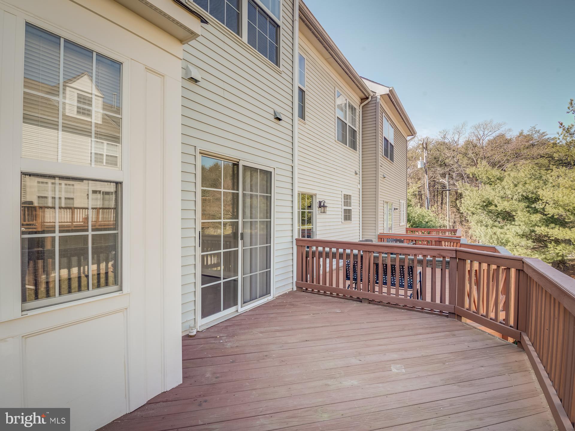 13510 Turquoise Lane Herndon, VA 20170 - Photo 26 of 54 a view of a balcony with wooden floor and fence