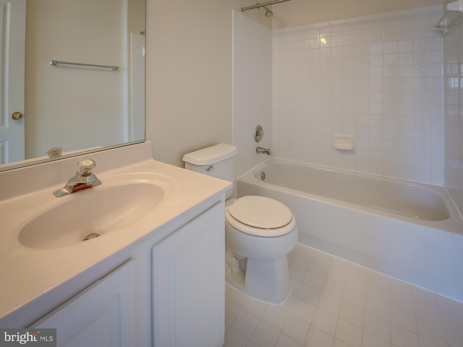 13510 Turquoise Lane Herndon, VA 20170 - Photo 33 of 54 a bathroom with a sink toilet and shower