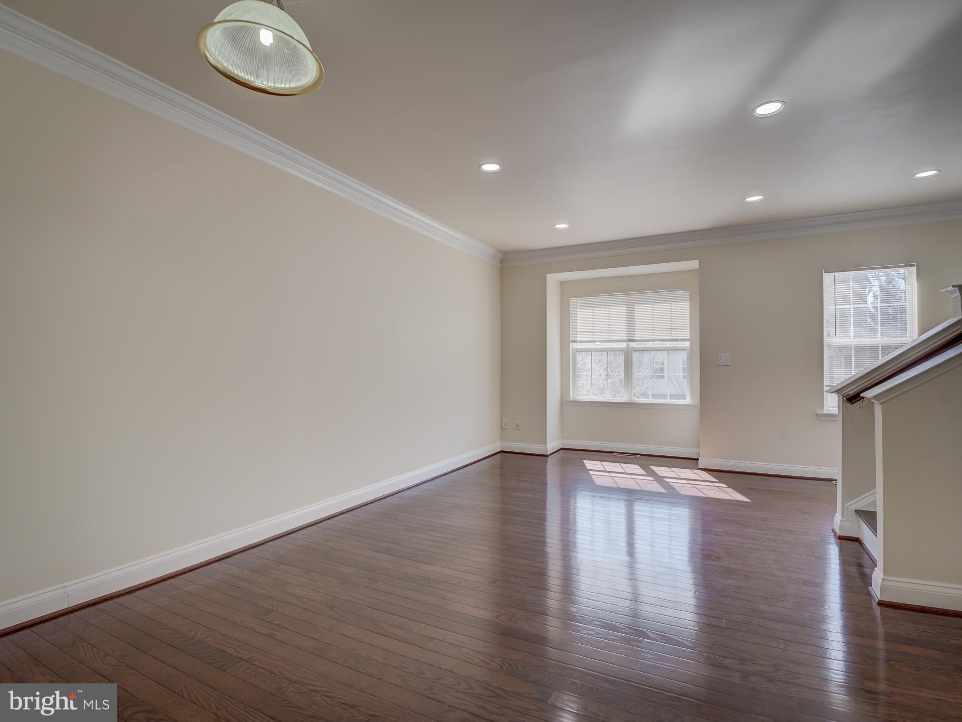 13510 Turquoise Lane Herndon, VA 20170 - Photo 10 of 54 a view of an empty room with wooden floor and a window