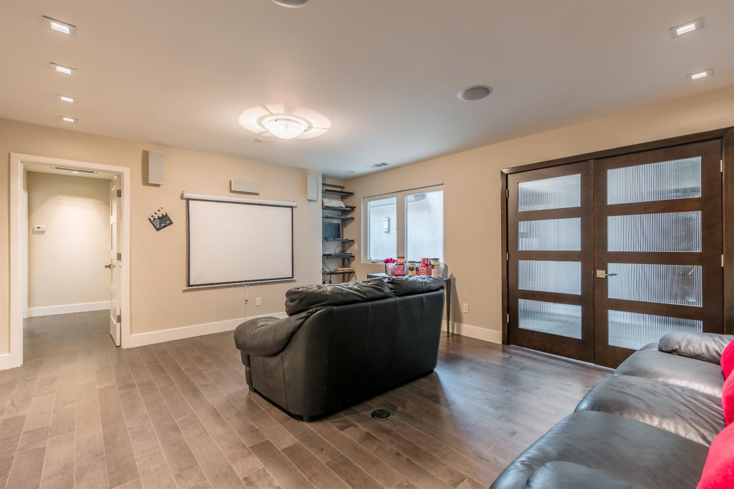 103 Arbuelo Way Los Altos, CA 94022 - Photo 18 of 45 a living room with furniture and a flat screen tv