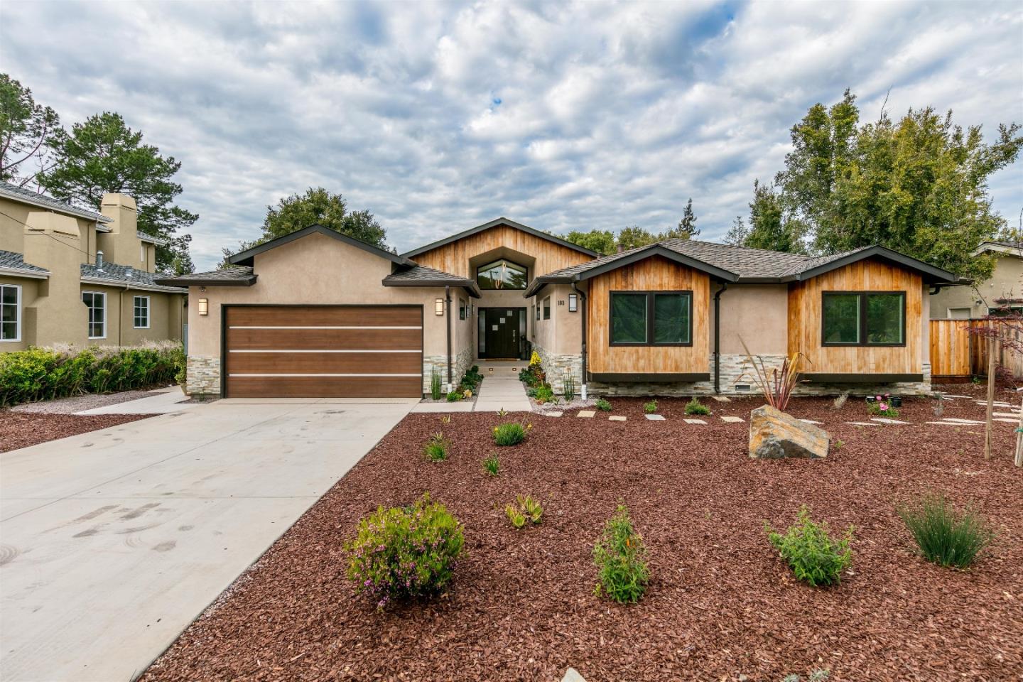 103 Arbuelo Way Los Altos, CA 94022 - Photo 2 of 45 a front view of a house with a garden and outdoor seating