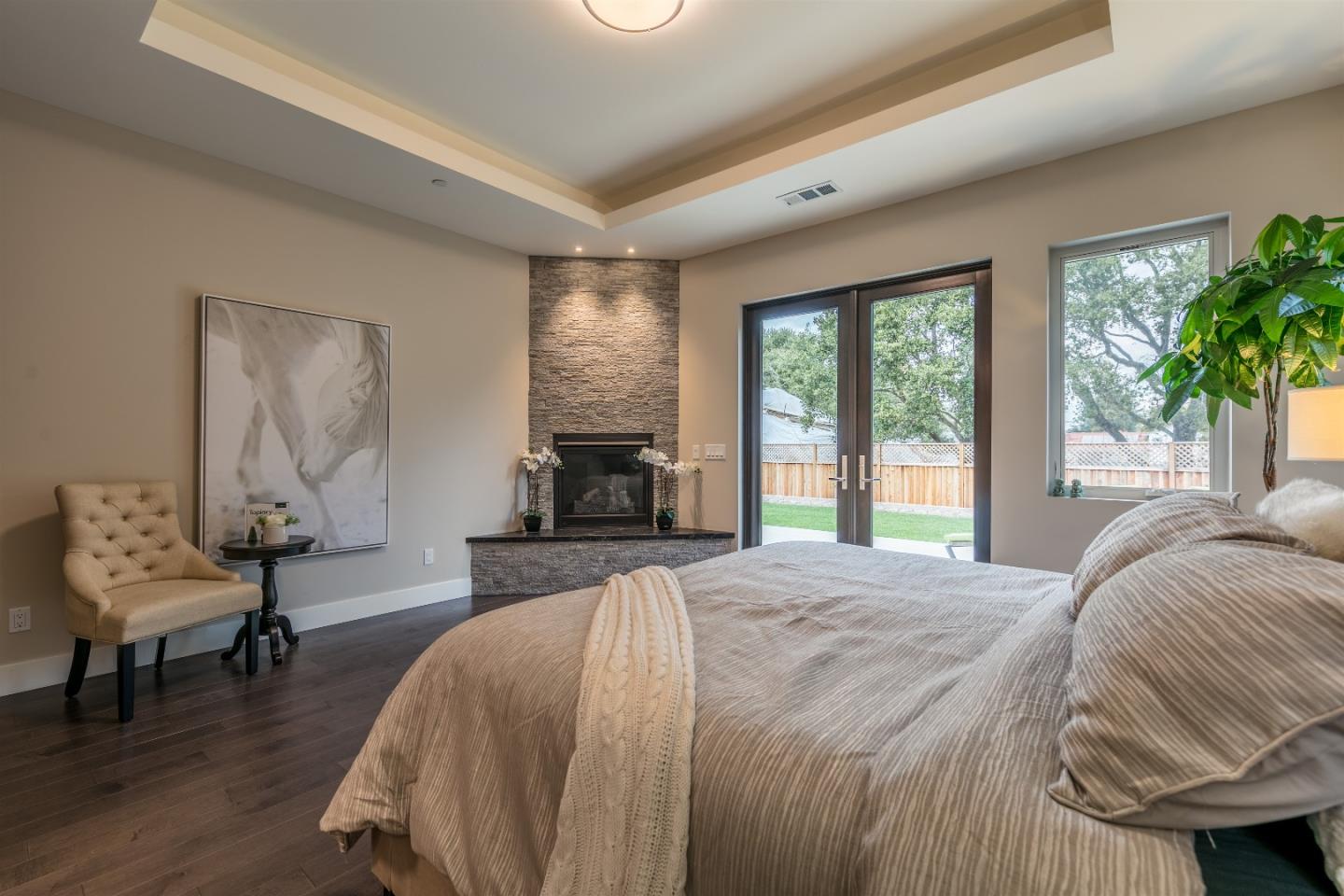 103 Arbuelo Way Los Altos, CA 94022 - Photo 22 of 45 a spacious bedroom with a bed and a couch