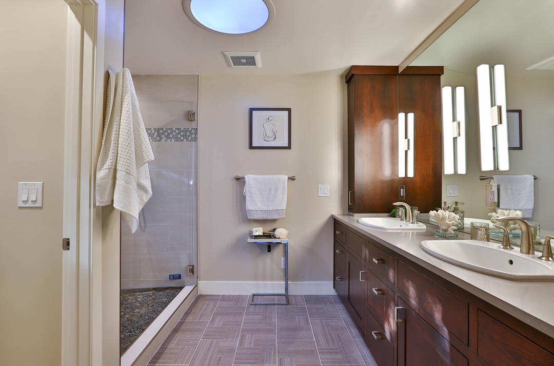 103 Arbuelo Way Los Altos, CA 94022 - Photo 24 of 45 a spacious bathroom with a double vanity sink a mirror and shower