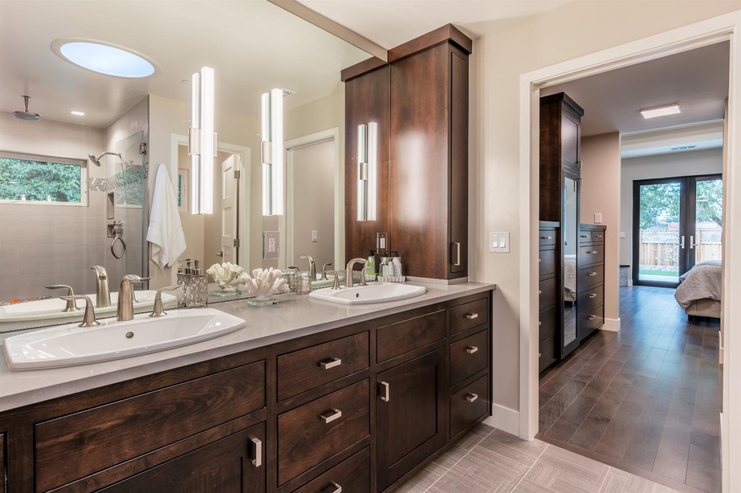 103 Arbuelo Way Los Altos, CA 94022 - Photo 25 of 45 a bathroom with a double vanity sink and a mirror