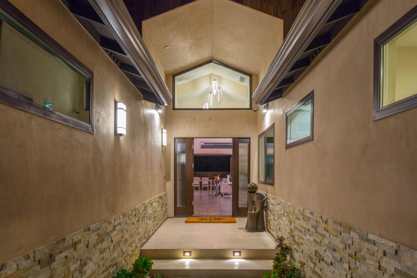 103 Arbuelo Way Los Altos, CA 94022 - Photo 42 of 45 a view of a hallway with wooden floor and staircase