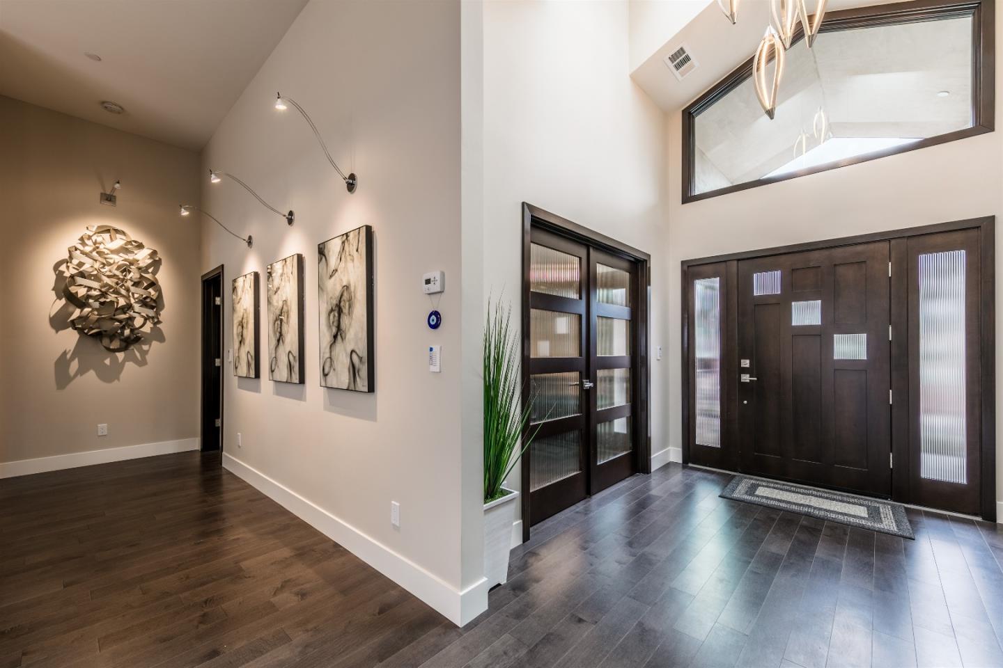 103 Arbuelo Way Los Altos, CA 94022 - Photo 6 of 45 an empty room with wooden floor and windows