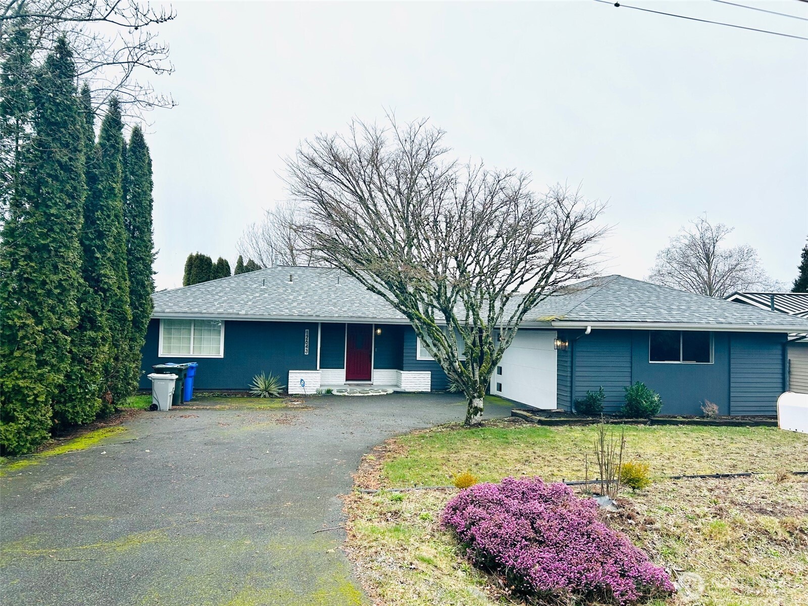 12643 156th Avenue Southeast Renton, WA 98059 - Photo 1 of 19 a front view of a house with a yard and garage