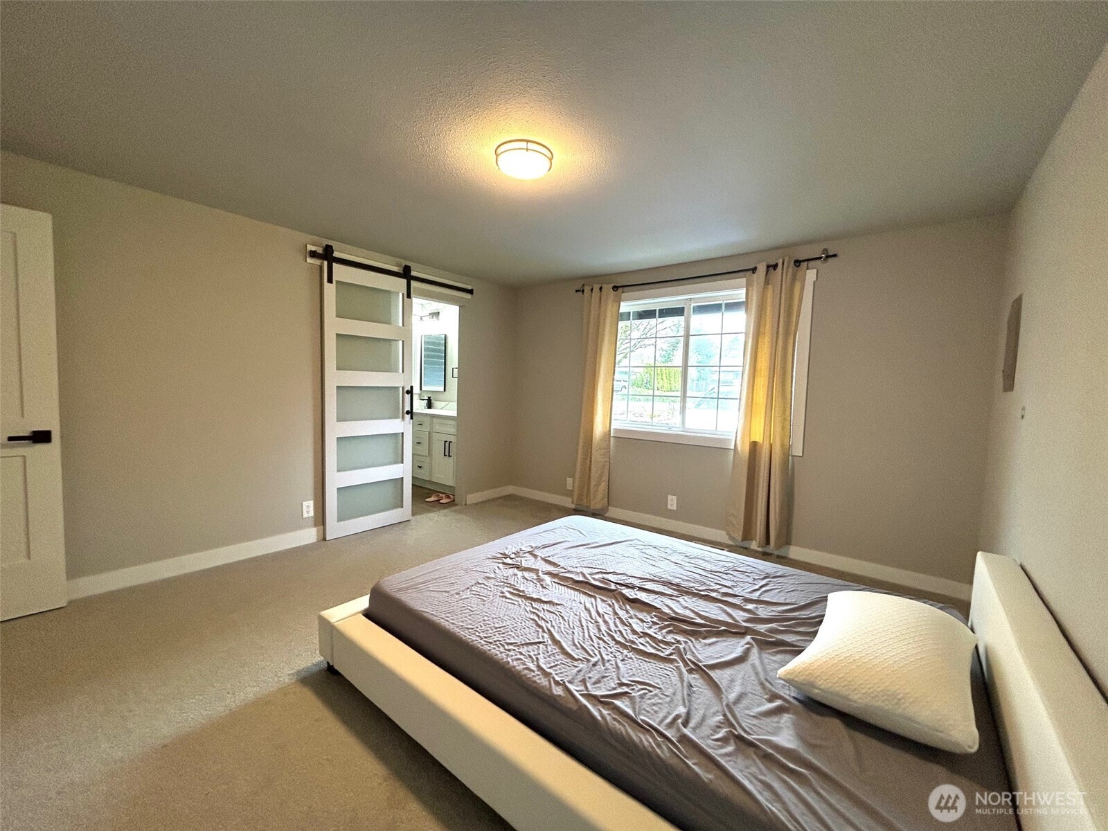 12643 156th Avenue Southeast Renton, WA 98059 - Photo 11 of 19 a bedroom with a bed and a window