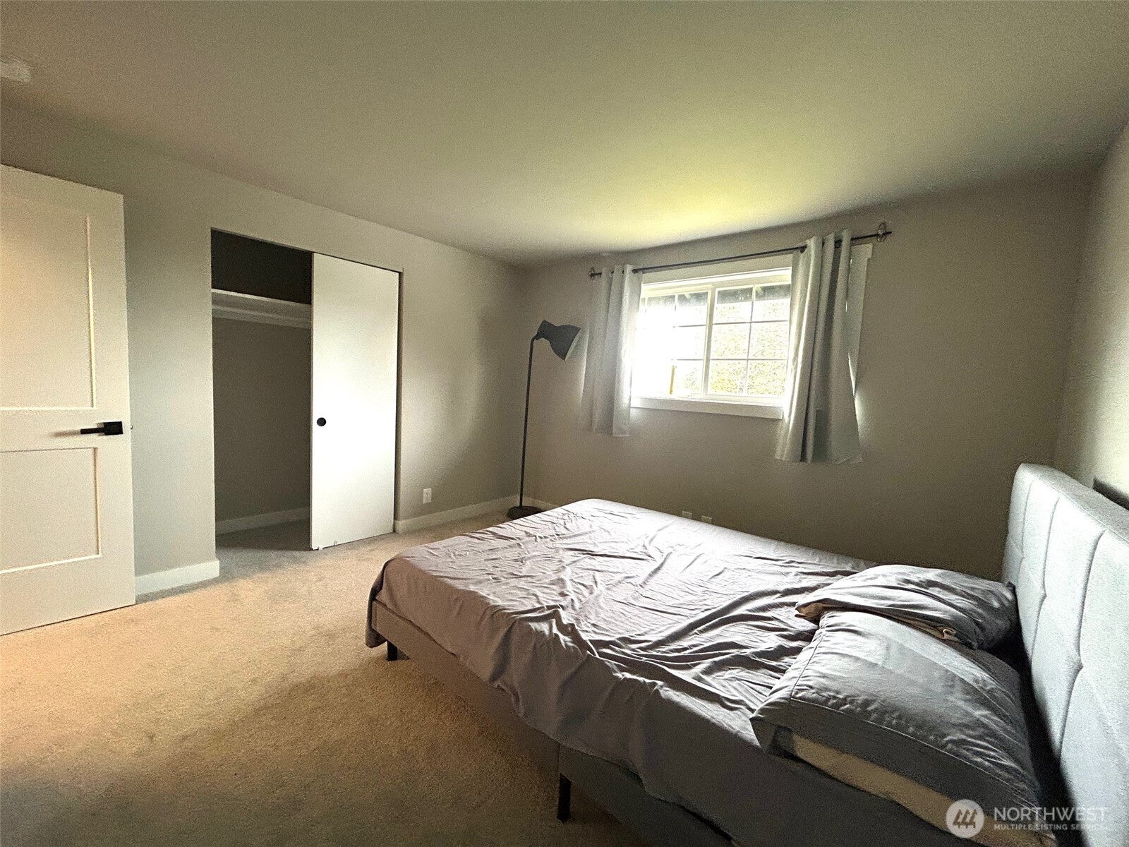 12643 156th Avenue Southeast Renton, WA 98059 - Photo 13 of 19 a bedroom with a bed and a window