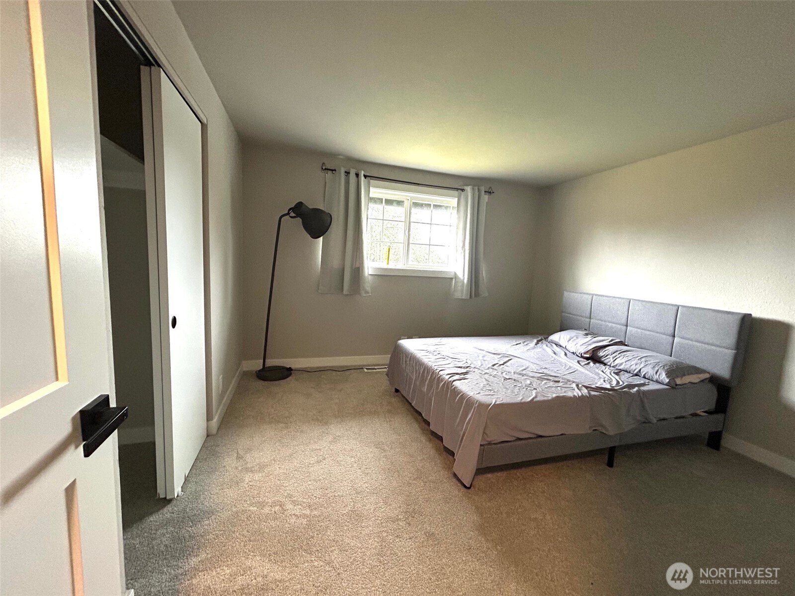 12643 156th Avenue Southeast Renton, WA 98059 - Photo 14 of 19 a bedroom with a bed and a window