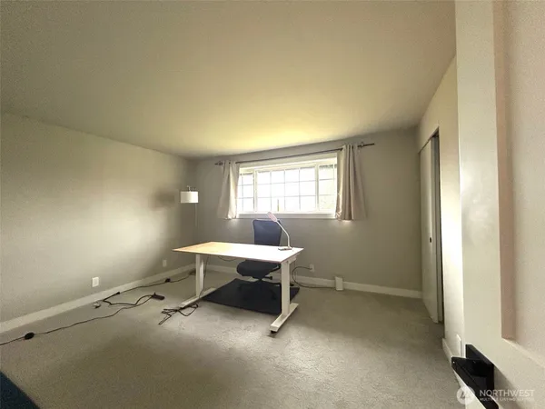 a workspace with furniture and window