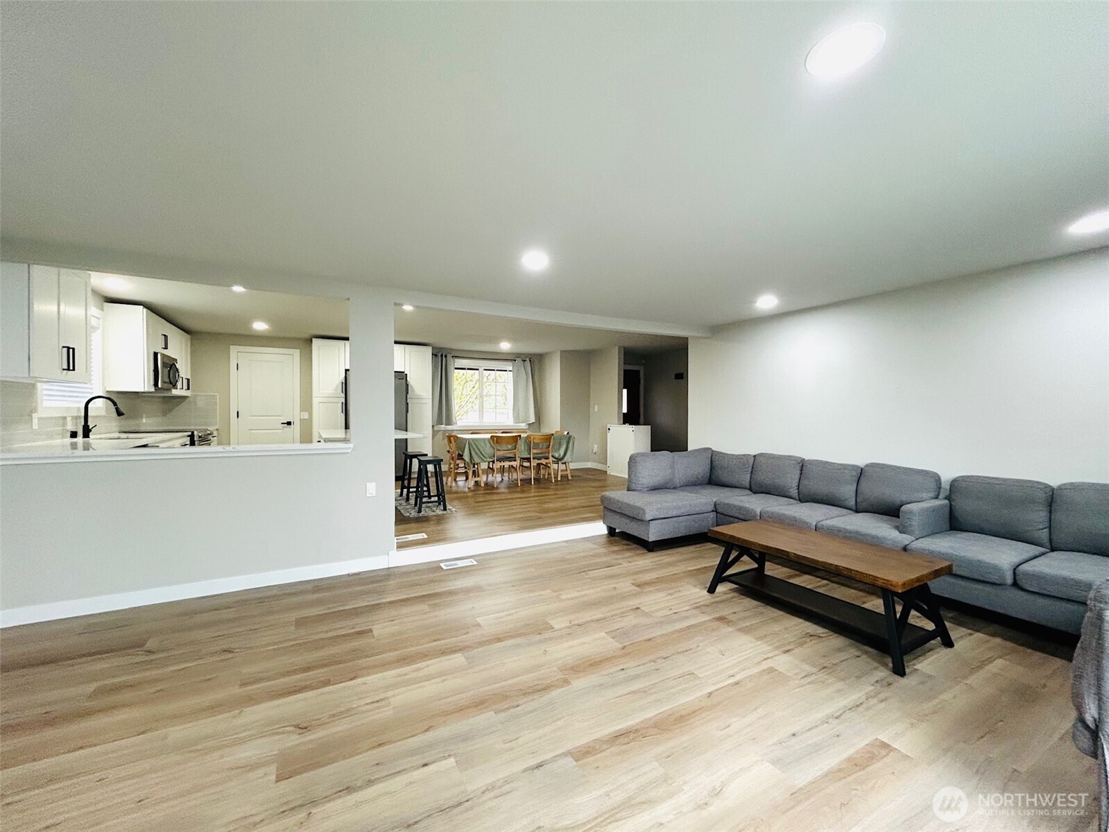 12643 156th Avenue Southeast Renton, WA 98059 - Photo 3 of 19 a living room with furniture and a wooden floor