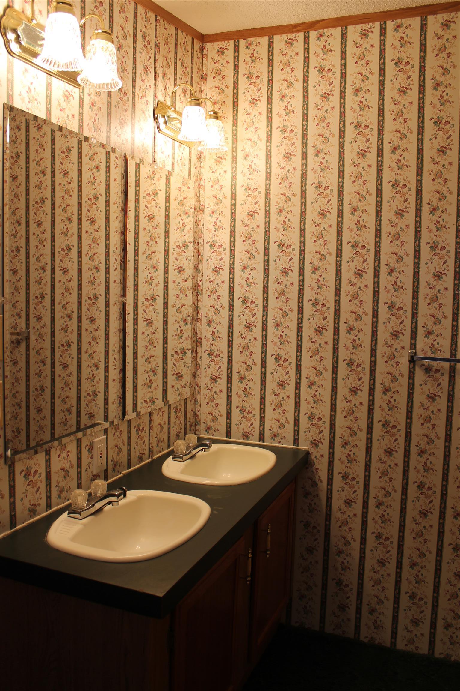 1925 Humphreys Co Line Road Dickson, TN 37055 - Photo 21 of 23 a bathroom with a double vanity sink and a mirror