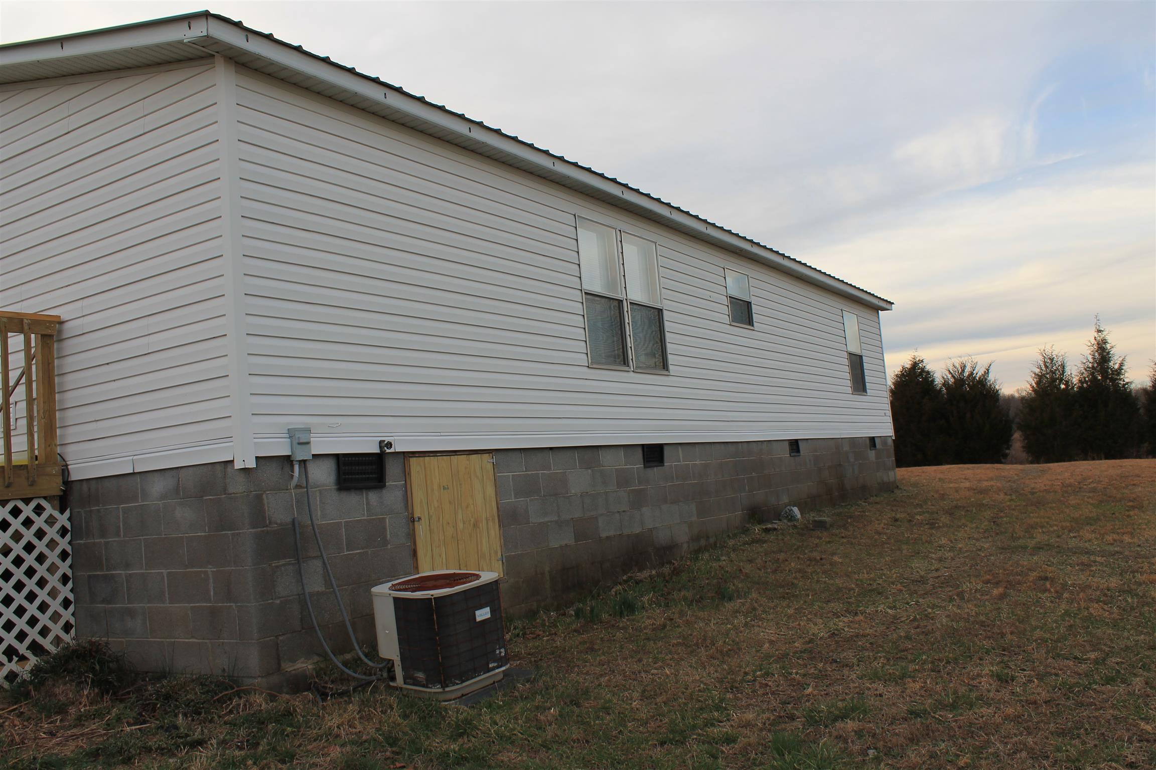 1925 Humphreys Co Line Road Dickson, TN 37055 - Photo 4 of 23 a backyard of a house