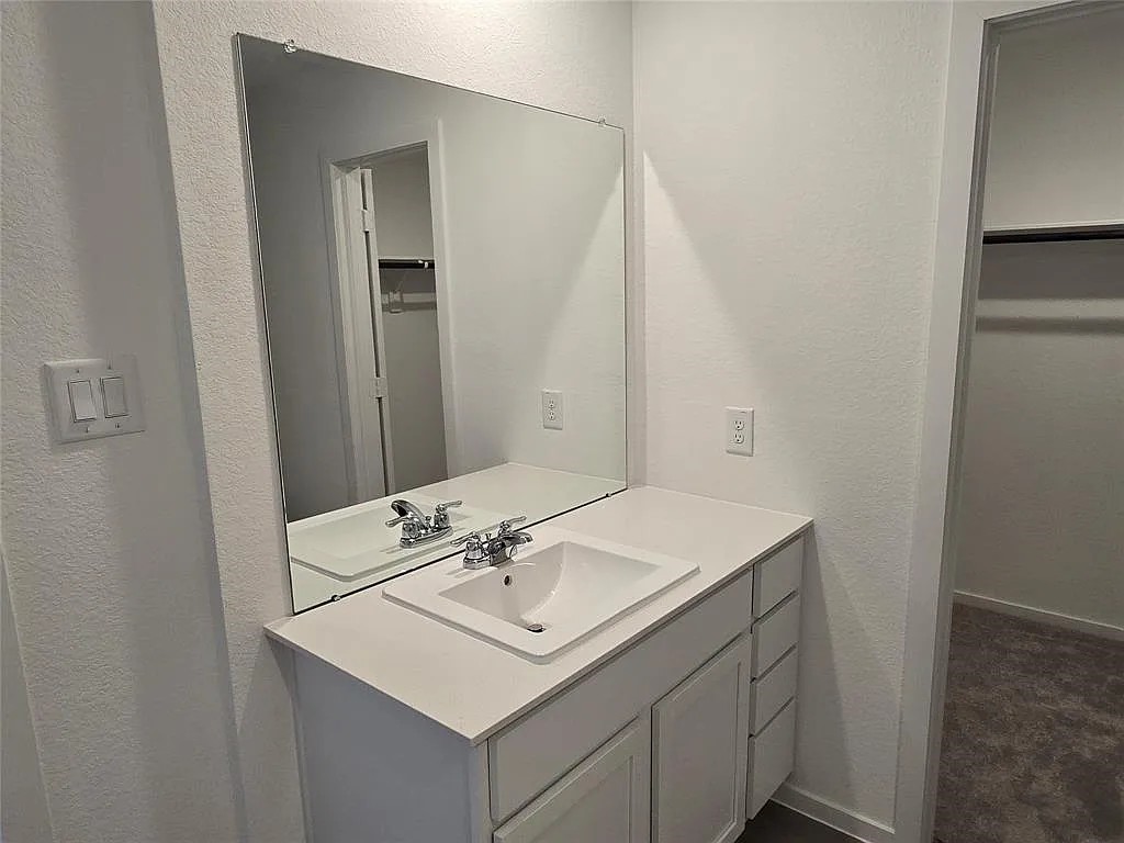 1771 West Stroker Road Crosby, TX 77532 - Photo 2 of 6 a bathroom with a sink and a mirror