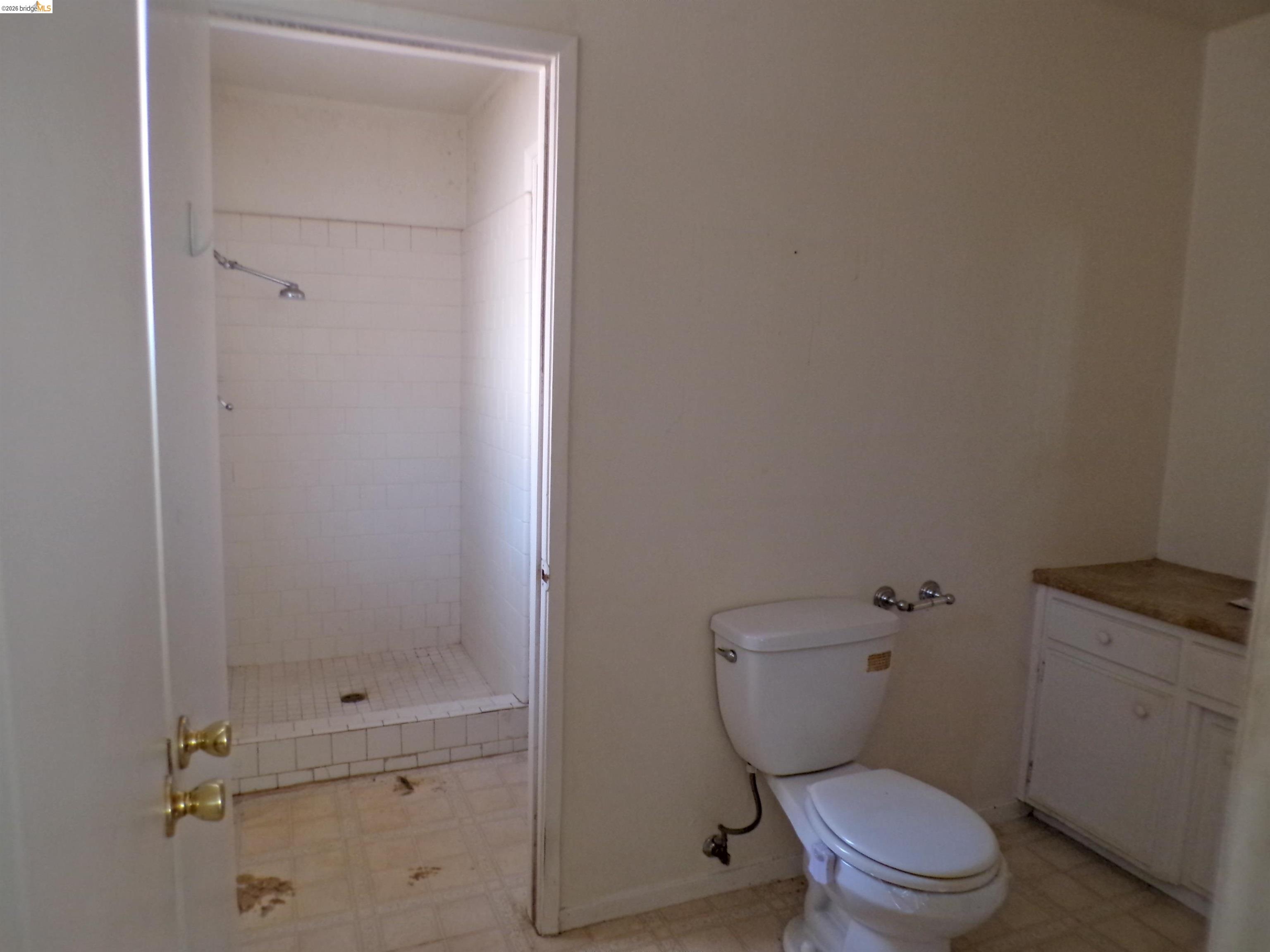 20663 Haiapo Road Mi Wuk Village, CA 95346 - Photo 13 of 24 a white toilet sitting next to a bathroom sink