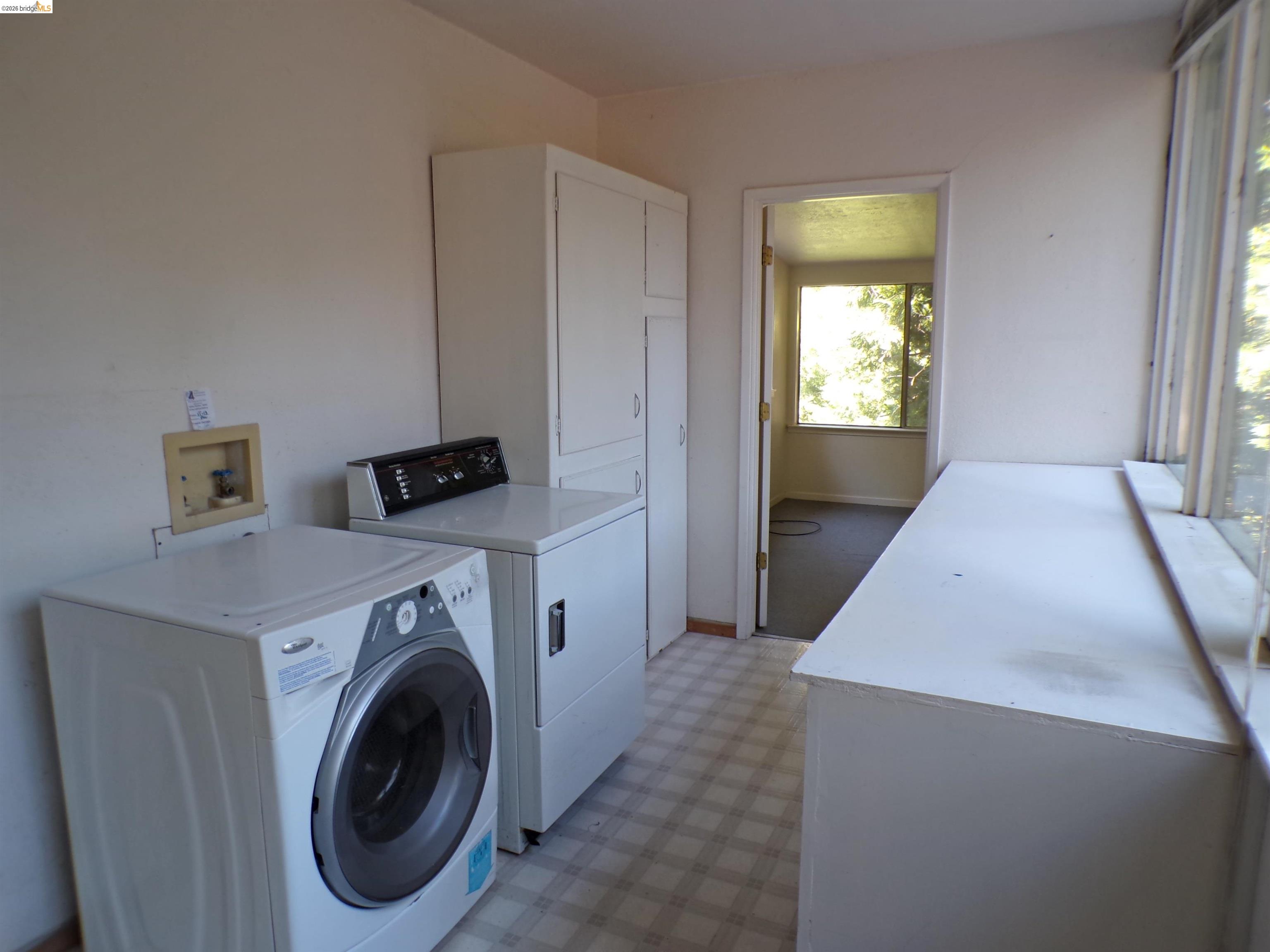 20663 Haiapo Road Mi Wuk Village, CA 95346 - Photo 16 of 24 a view of a storage & utility room with washer and dryer