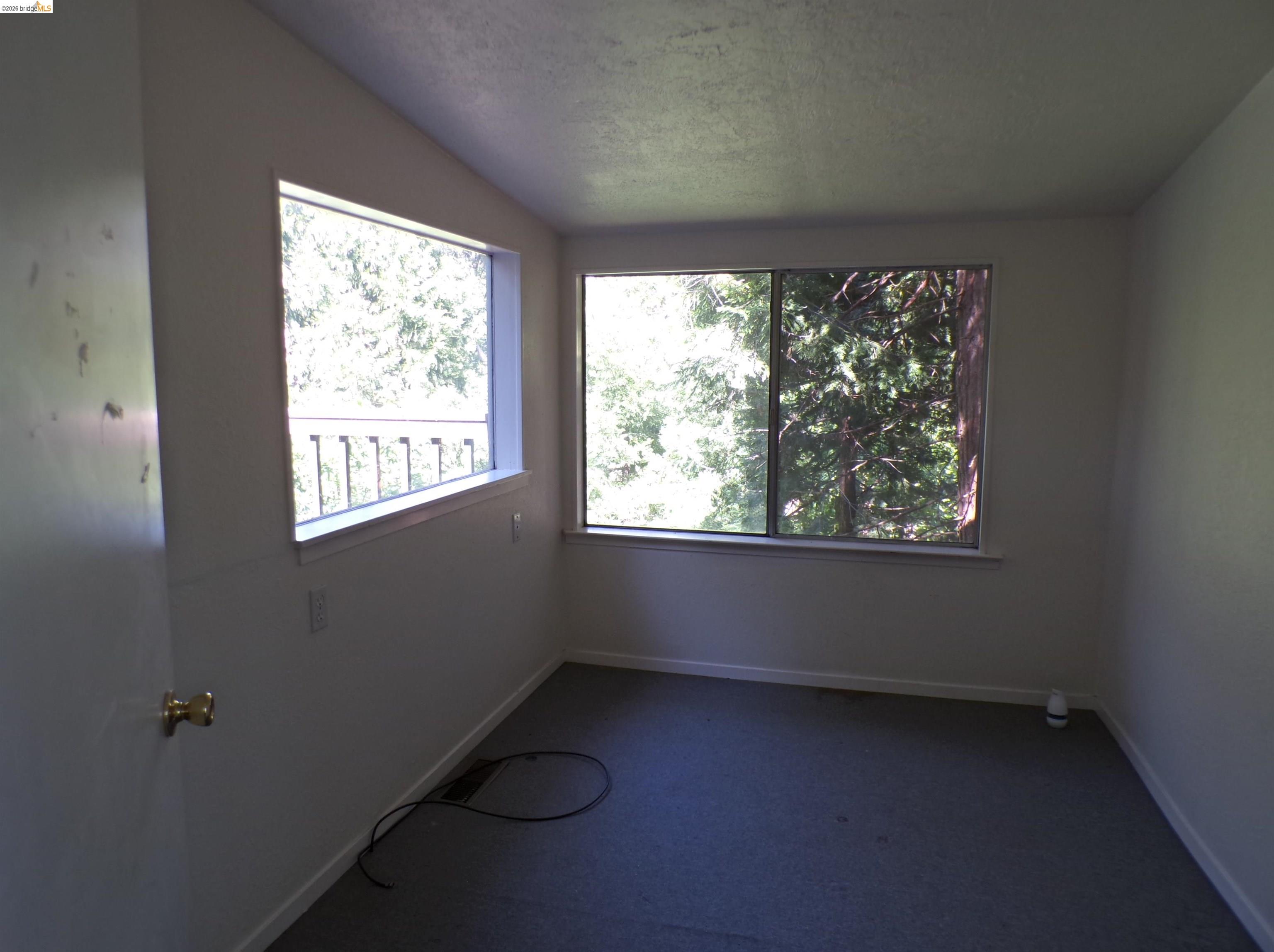 20663 Haiapo Road Mi Wuk Village, CA 95346 - Photo 17 of 24 an empty room with a window