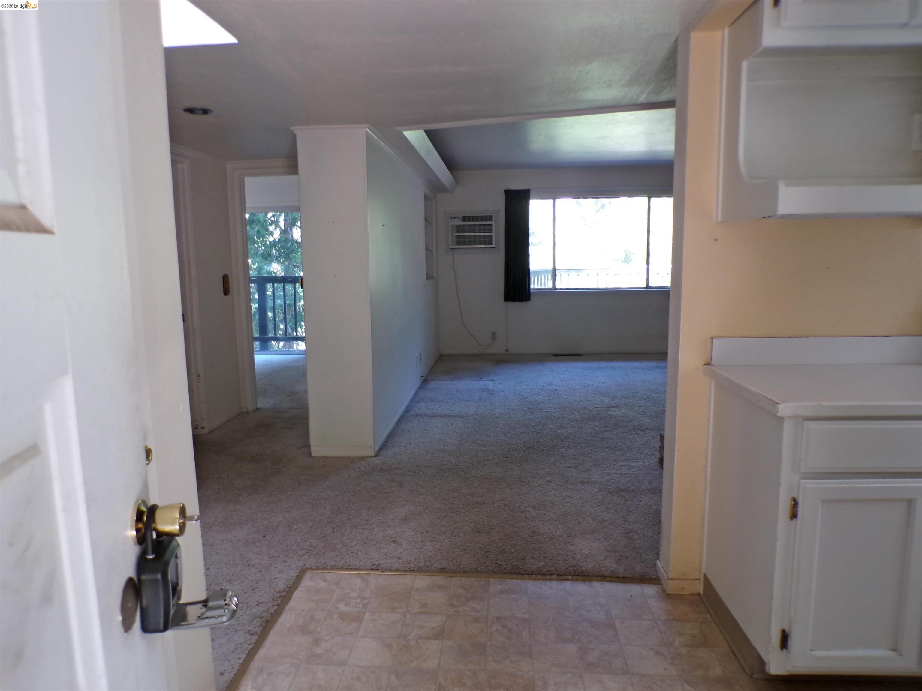 20663 Haiapo Road Mi Wuk Village, CA 95346 - Photo 5 of 24 an empty room with windows and flowerpot