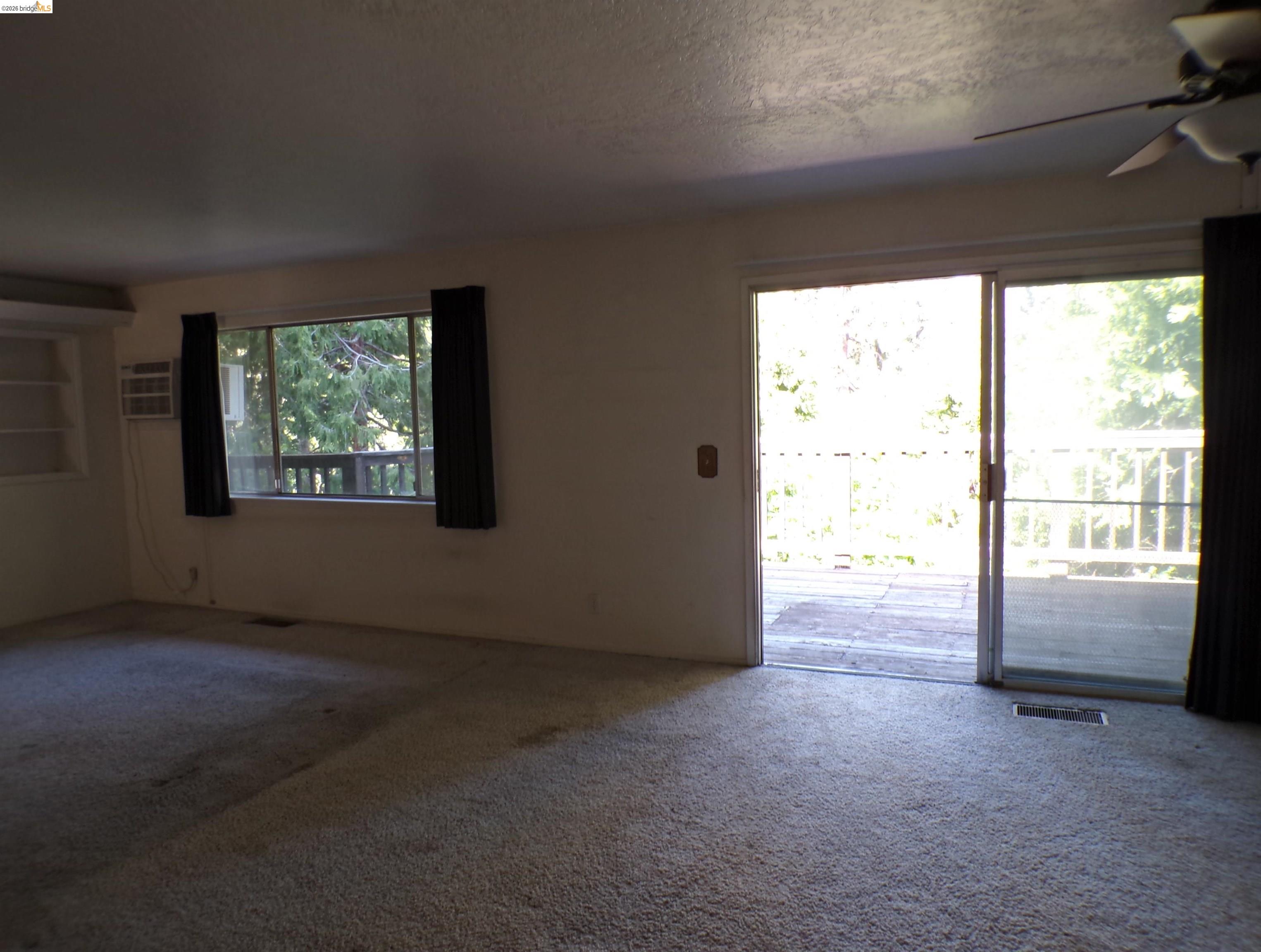 20663 Haiapo Road Mi Wuk Village, CA 95346 - Photo 9 of 24 an empty room with windows