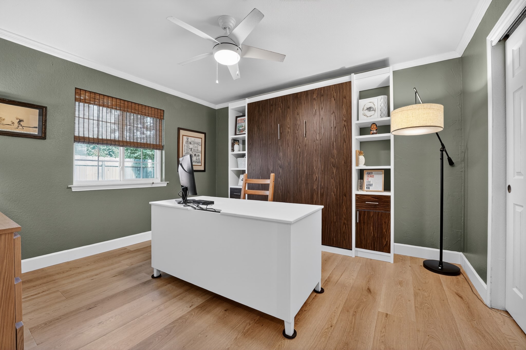 1811 Old Mill Road Cedar Park, TX 78613 - Photo 29 of 39 Well-lit room with wood flooring and built-in shelving offers a versatile space for work or rest.