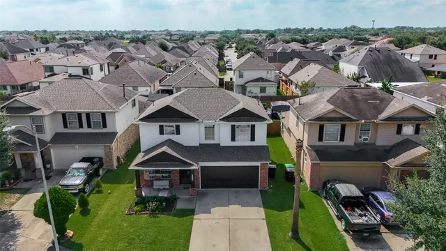 an aerial view of a house with a garden