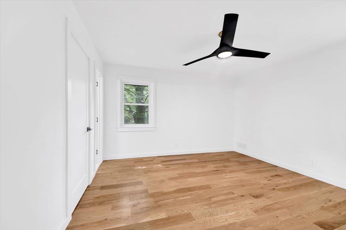 132 Holmes Avenue Hartsdale, NY 10530 - Photo 11 of 34 a view of empty room with window and ceiling fan