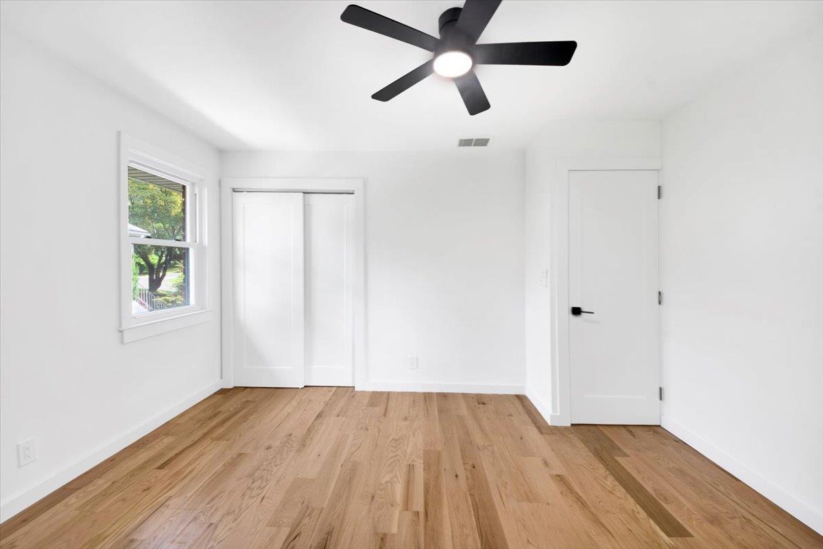 132 Holmes Avenue Hartsdale, NY 10530 - Photo 14 of 34 an empty room with wooden floor closet and windows