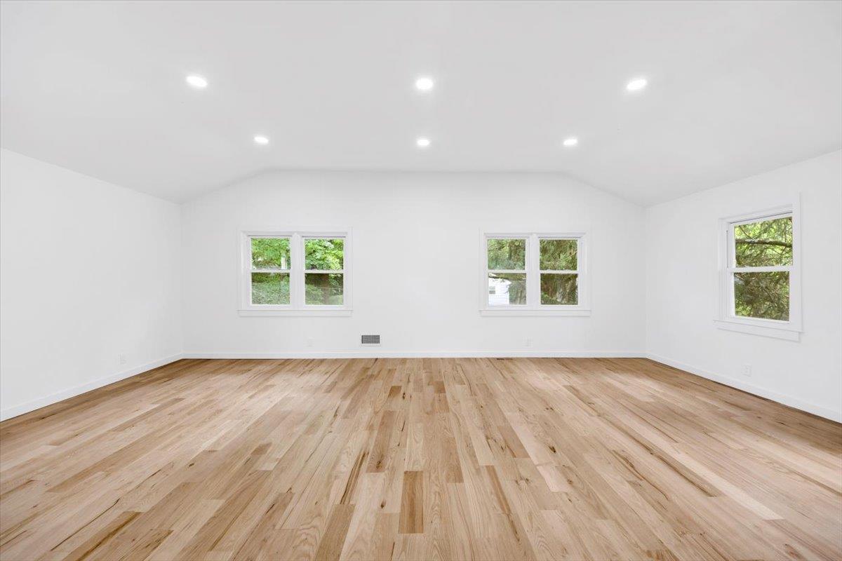 132 Holmes Avenue Hartsdale, NY 10530 - Photo 17 of 34 an empty room with wooden floor and windows