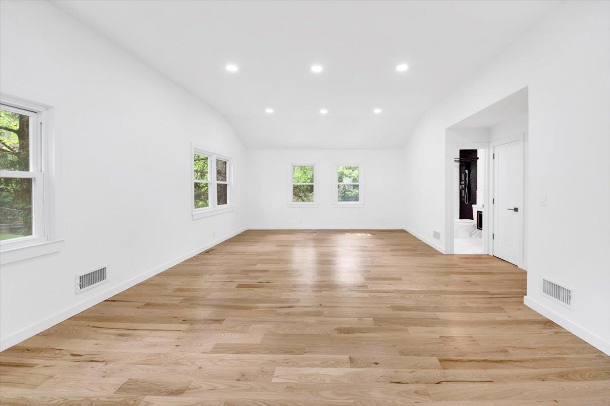 132 Holmes Avenue Hartsdale, NY 10530 - Photo 18 of 34 a view of empty room with wooden floor and fan