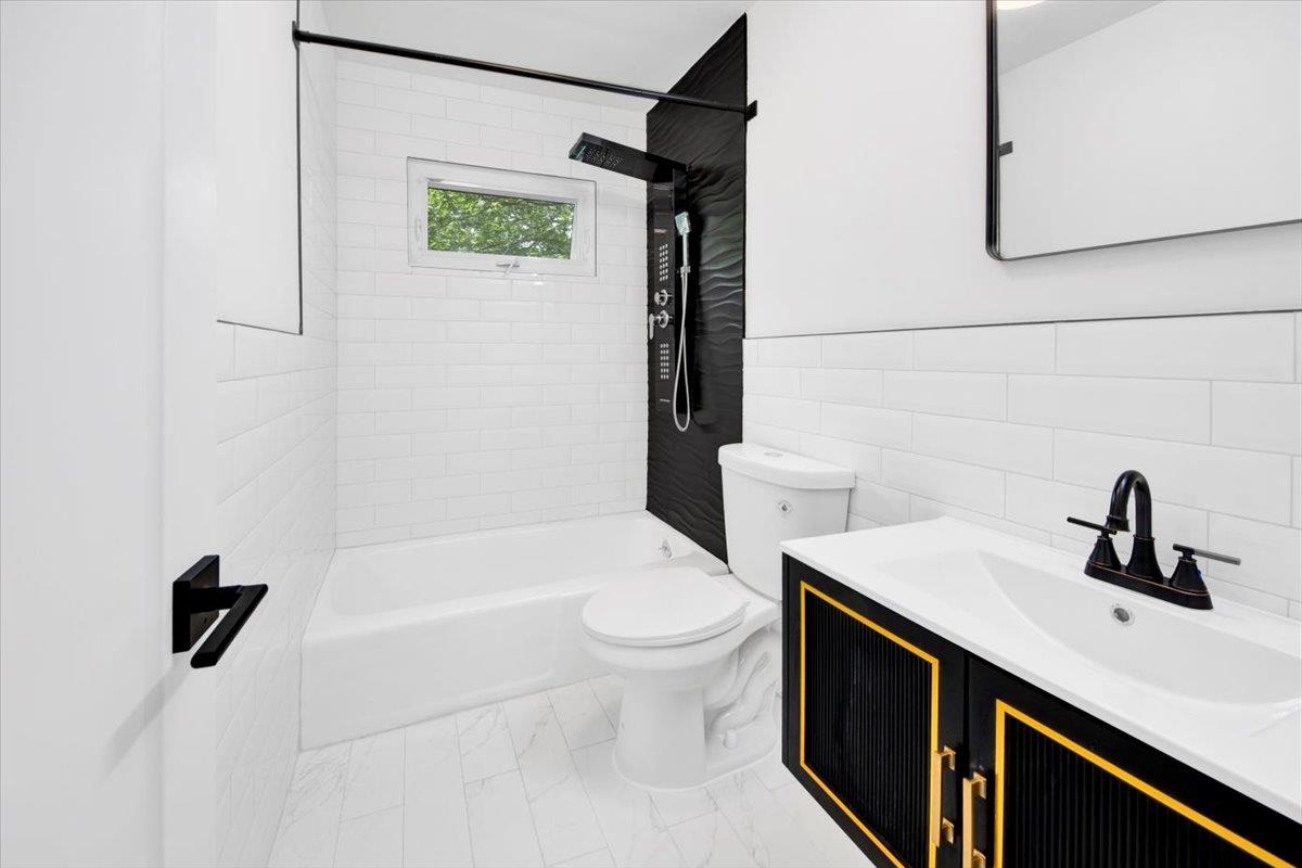 132 Holmes Avenue Hartsdale, NY 10530 - Photo 19 of 34 a bathroom with a sink a toilet and shower