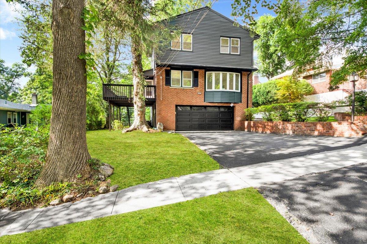 132 Holmes Avenue Hartsdale, NY 10530 - Photo 2 of 34 a front view of a house with garden