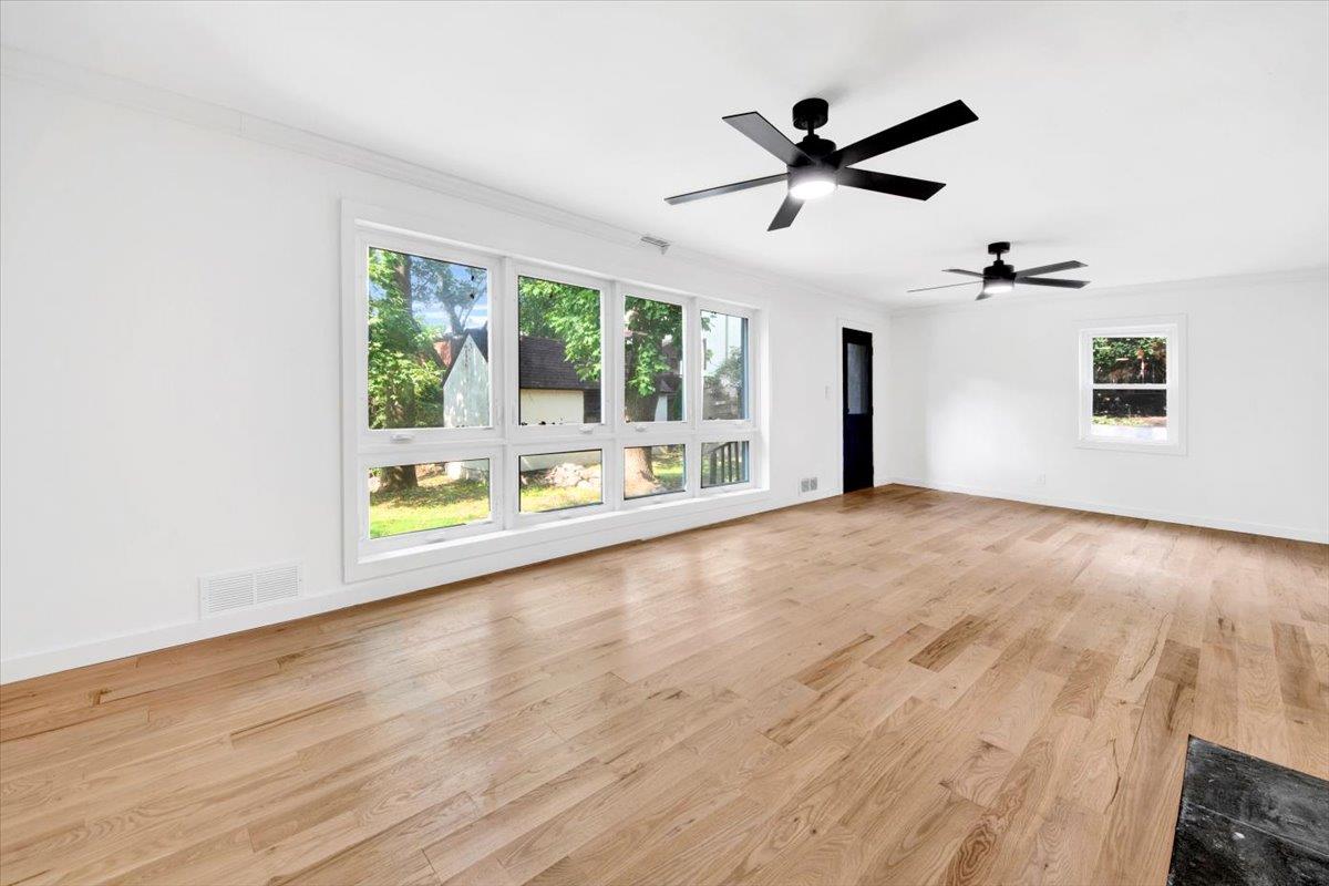 132 Holmes Avenue Hartsdale, NY 10530 - Photo 22 of 34 a view of a livingroom with a ceiling fan furniture and a large window