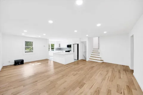 a view of kitchen with sink and natural light