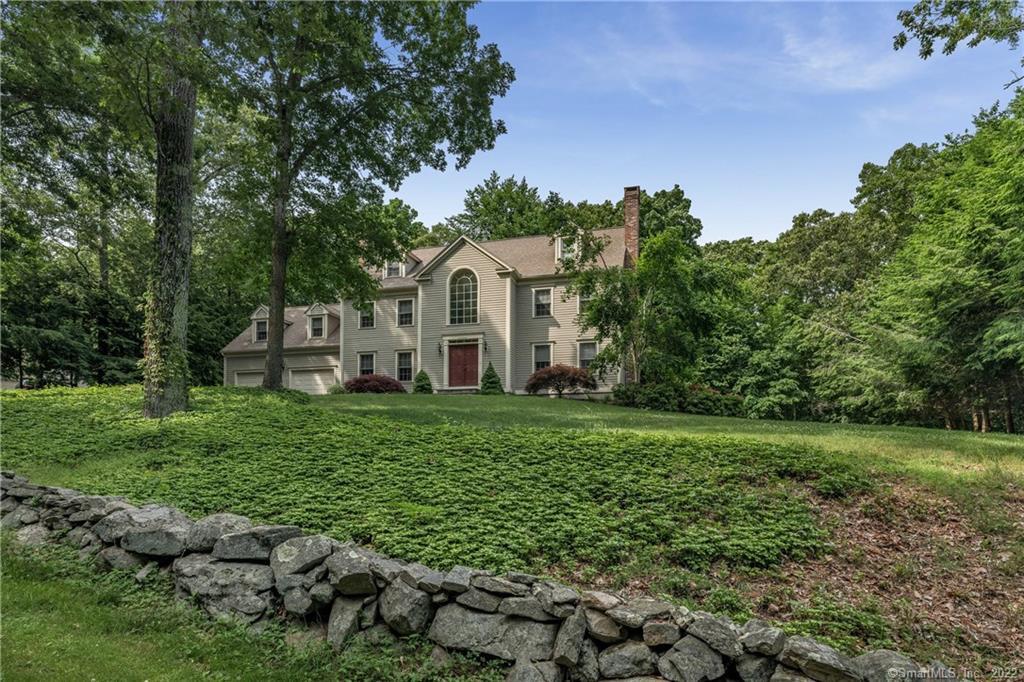 222 Ingham Hill Road Old Saybrook, CT 06475 - Photo 1 of 1 a front view of a house with a yard