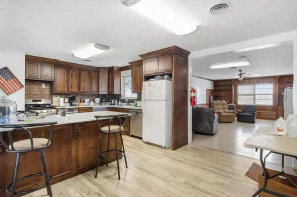 a kitchen with a sink a stove and cabinets