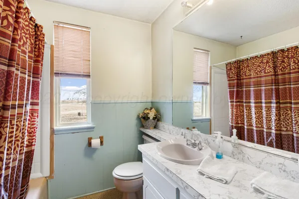 a room with a bed and a chandelier