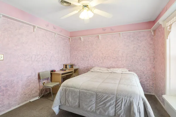 a bathroom with a bathtub and a window