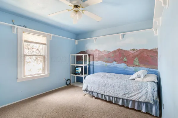 a kitchen with a sink stove and mirror