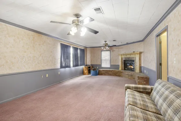 a view of livingroom with furniture and window