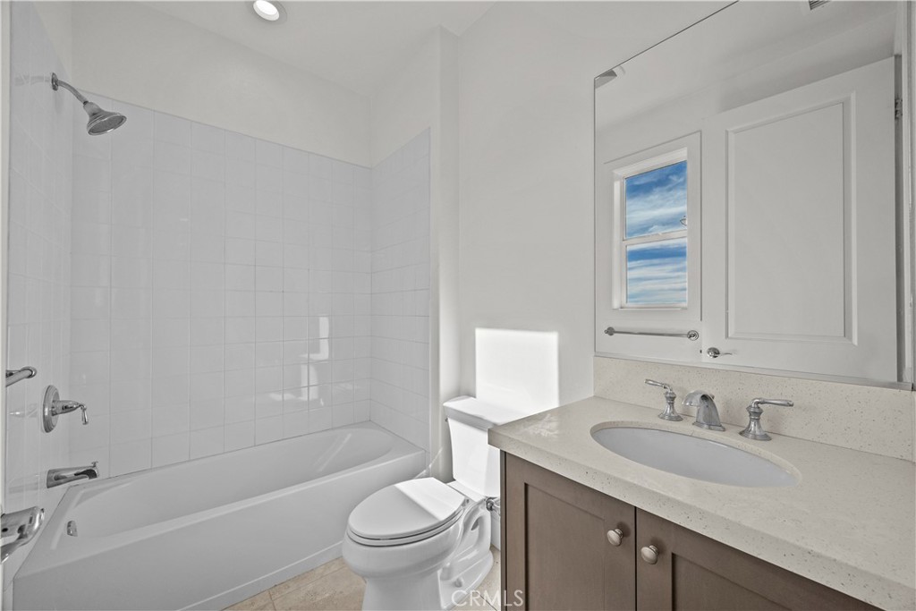 20638 Deer Grass Court Porter Ranch, CA 91326 - Photo 40 of 50 a bathroom with a granite countertop sink toilet and shower