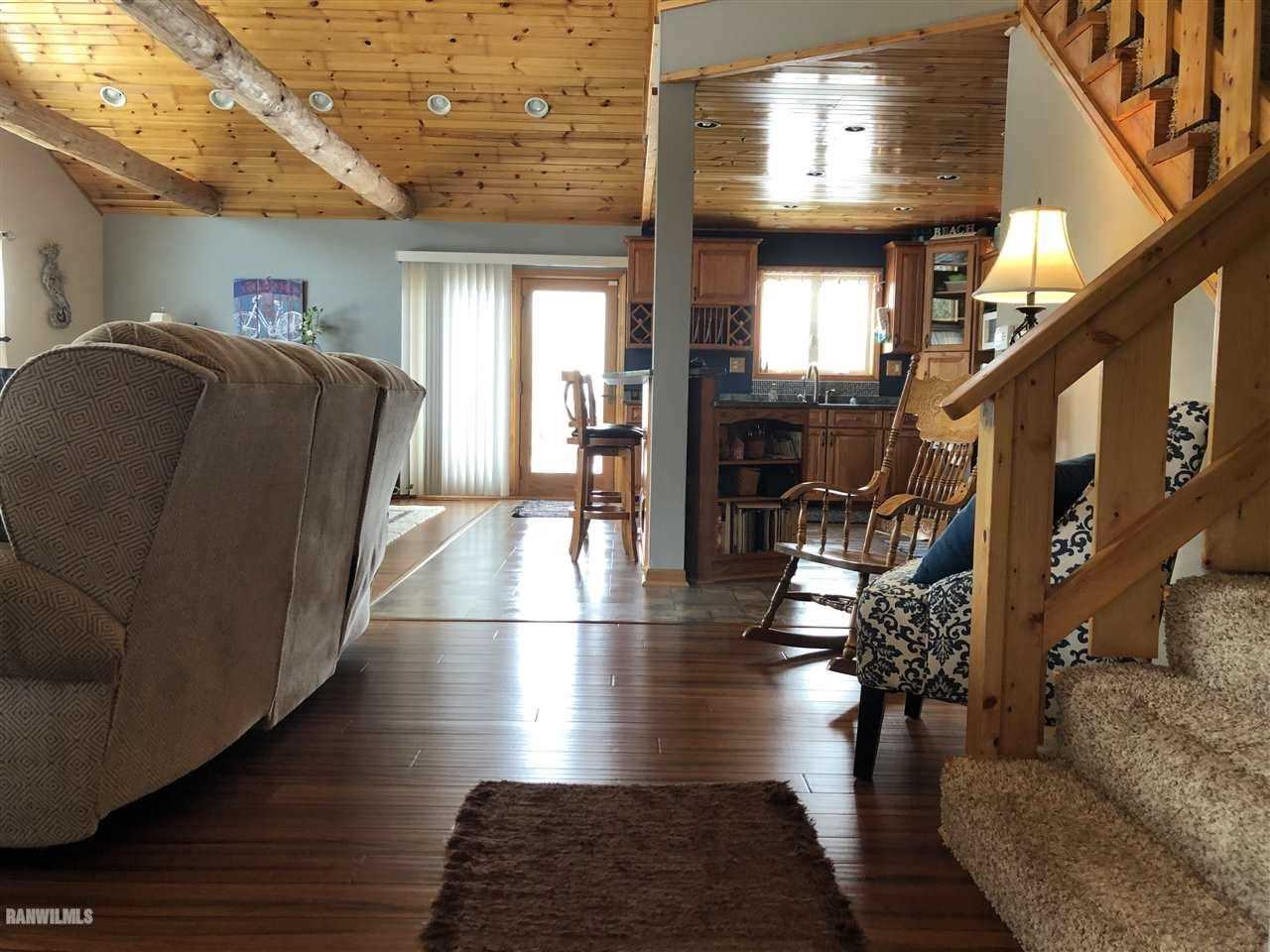 7695 East Winneshiek Road Ridott, IL 61067 - Photo 13 of 15 a view of entryway and hall with wooden floor