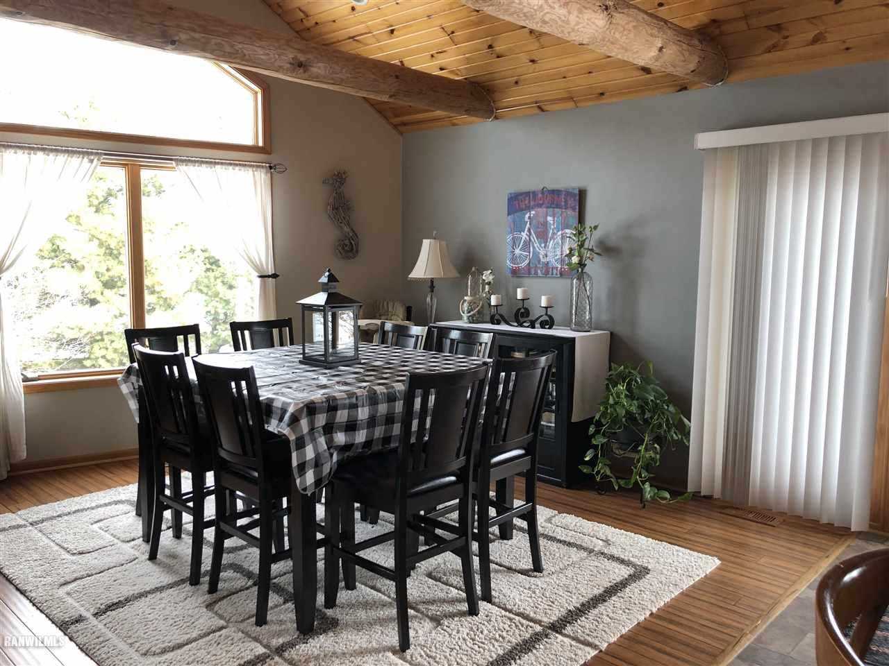 7695 East Winneshiek Road Ridott, IL 61067 - Photo 5 of 15 a view of a dining room with furniture window and outside view