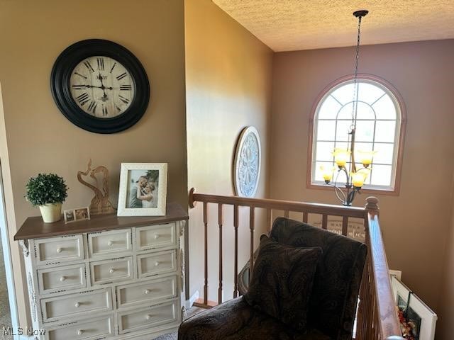 2761 Omega Road Greenwich, OH 44837 - Photo 23 of 50 Living area featuring a notable chandelier and a textured ceiling