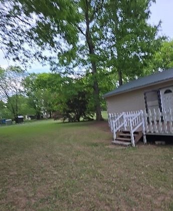 2174 Pleasant Hill Road Lynchburg, TN 37352 - Photo 5 of 16 a view of a backyard with a garden and entertaining space