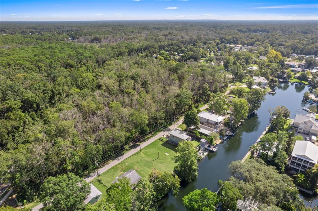 5492 Ramada Street Weeki Wachee, FL 34607 - Photo 14 of 25 an aerial view of a residential houses covered in trees