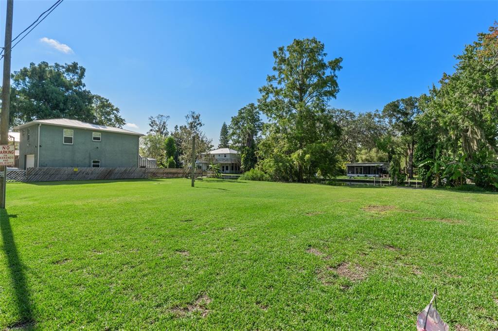 5492 Ramada Street Weeki Wachee, FL 34607 - Photo 24 of 25 a view of a field of grass and trees