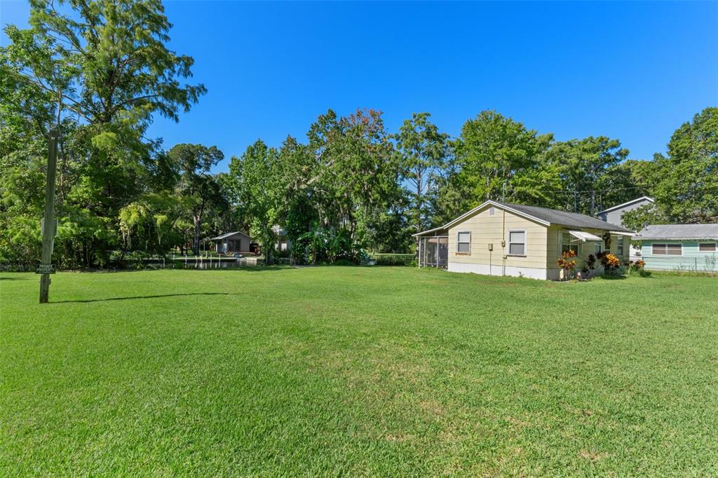 5492 Ramada Street Weeki Wachee, FL 34607 - Photo 25 of 25 a view of a house with a yard